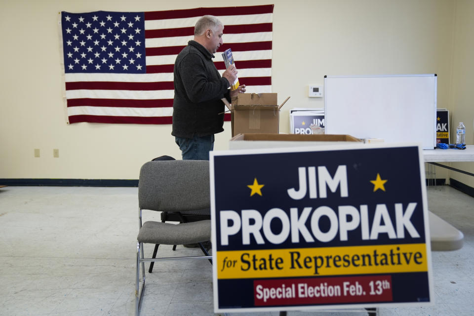Jim Prokopiak, Democratic nominee for a Bucks County special election to fill a vacant Pennsylvania state House seat, picks up flyers to go door knocking from his election headquarters in Fairless Hills, Pa., Tuesday, Jan. 30, 2024. (AP Photo/Matt Rourke)