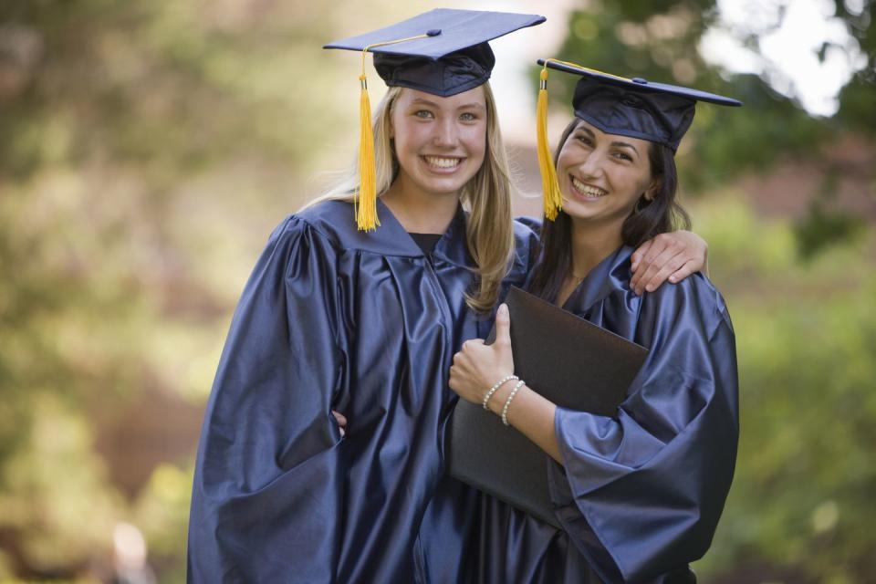 friends smile after graduation