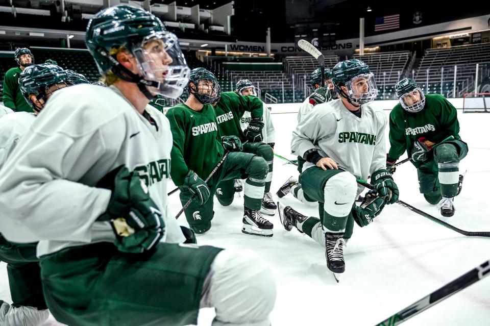 Michigan State listens to head coach Adam Nightingale in practice during hockey media day on Wednesday, Sept. 27, 2023, at Munn Arena in East Lansing.