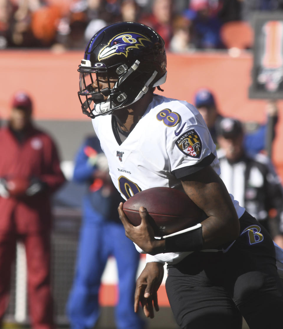 Baltimore Ravens quarterback Lamar Jackson looks for running room on Sunday December 22, 2019, afternoon at FirstEnergy Stadium in Cleveland, Ohio. (Warren Dillaway/The Star-Beacon via AP)