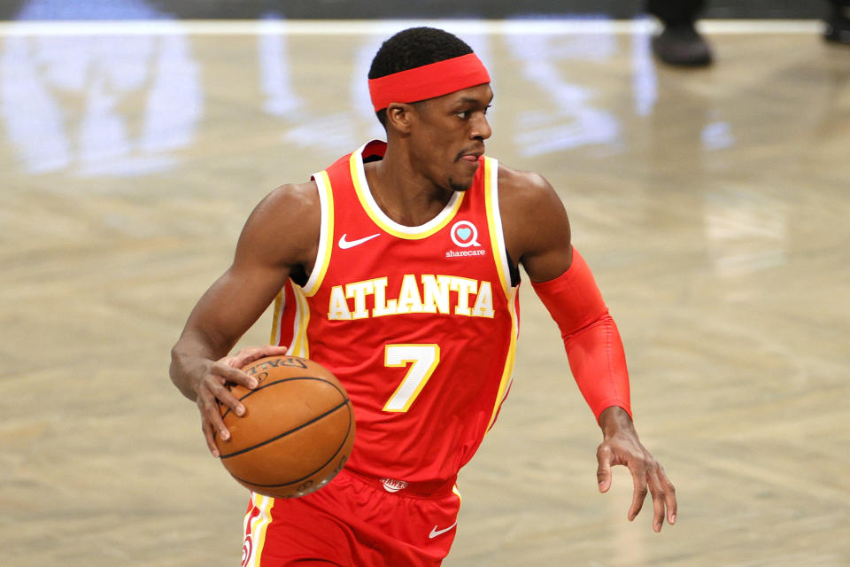 Rajon Rondo #7 of the Atlanta Hawks dribbles during the first half against the Brooklyn Nets at Barclays Center on December 30, 2020 in the Brooklyn borough of New York City. NOTE TO USER: User expressly acknowledges and agrees that, by downloading and/or using this Photograph, user is consenting to the terms and conditions of the Getty Images License Agreement. (Photo by Sarah Stier/Getty Images)