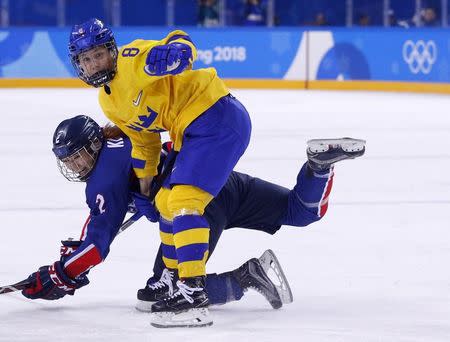 Ice Hockey – Pyeongchang 2018 Winter Olympics – Women Preliminary Round Match - Sweden v Korea - Kwandong Hockey Centre, Gangneung, South Korea – February 12, 2018 - Annie Svedin of Sweden and Ko Hye-in of Korea in action. REUTERS/Brian Snyder