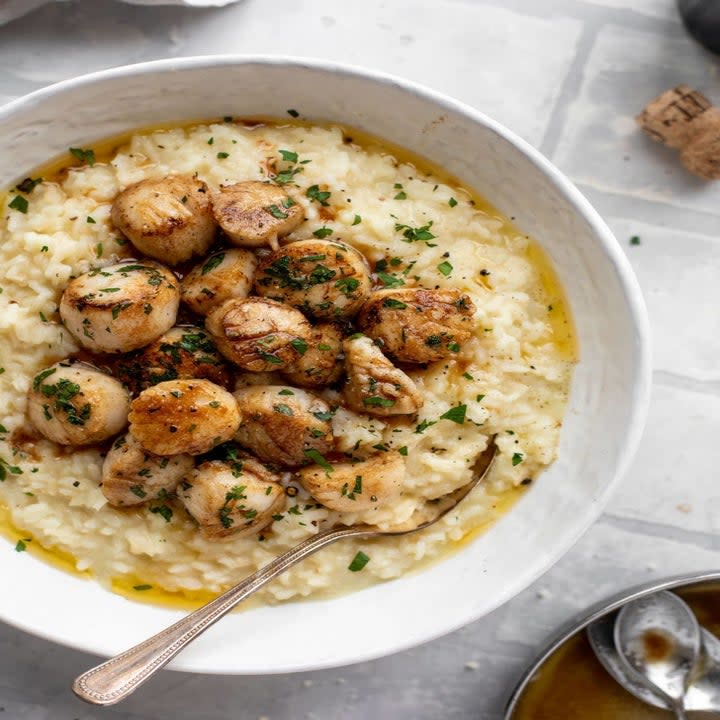 Scallops over risotto.