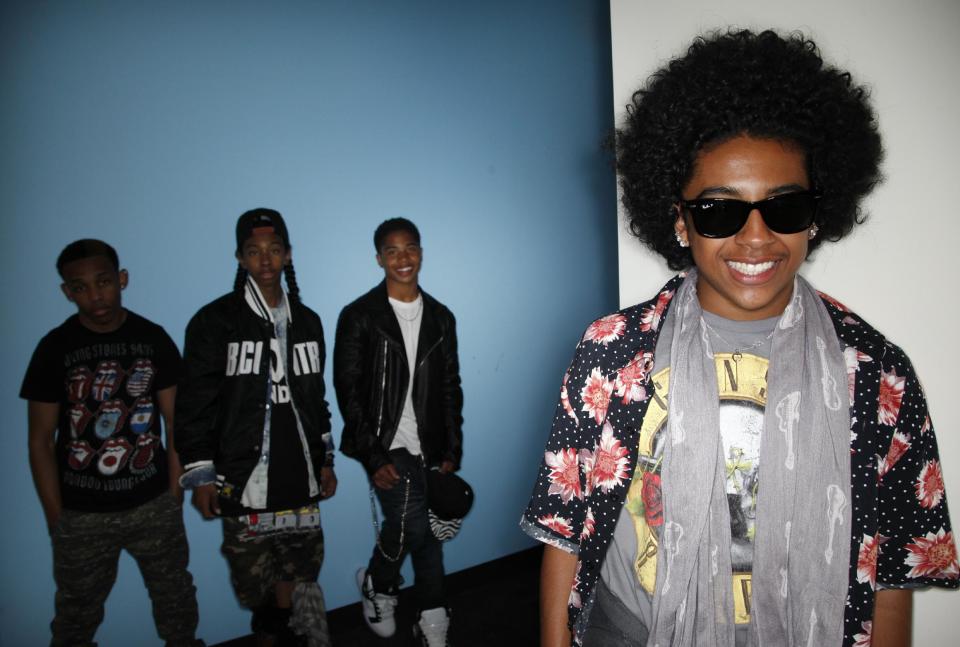 CAPTION CORRECTION OF NAME: In this Tuesday, April 9, 2013 photo, members of teen R&B boy band, Mindless Behavior, Princeton, from right, Roc Royal, Ray Ray, and Prodigy pose for photos in Los Angeles. The group kicks off their “All Around the World” tour July 3, 2013, in Stockton, Calif. (AP Photo/Jae C. Hong)