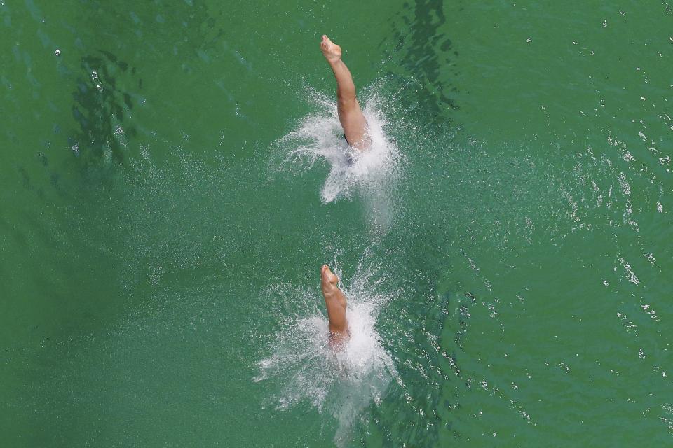 2016 Rio Olympics - Diving - Final - Women's Synchronised 10m Platform - Maria Lenk Aquatics Centre - Rio de Janeiro, Brazil - 09/08/2016. Kuk Hyang Kim (PRK) of North Korea and Kim Mi Rae (PRK) of North Korea compete. REUTERS/Michael Dalder FOR EDITORIAL USE ONLY. NOT FOR SALE FOR MARKETING OR ADVERTISING CAMPAIGNS.