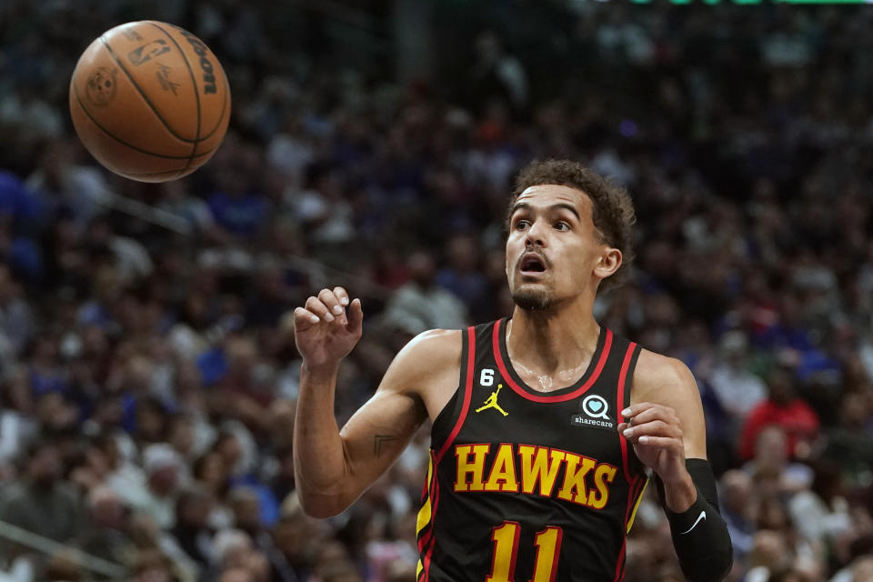 Atlanta Hawks guard Trae Young (11) takes a pass during the first quarter of an NBA basketball game against the Dallas Mavericks in Dallas, Wednesday, Jan. 18, 2023. (AP Photo/LM Otero)