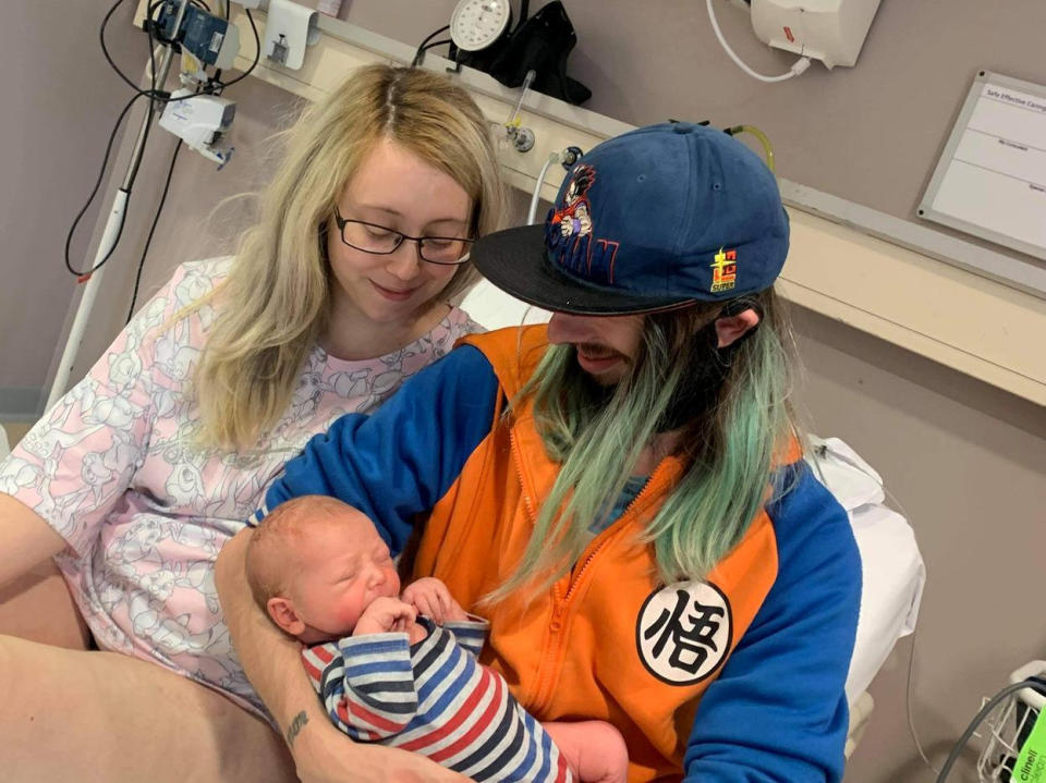 Tasha Davies and Martin Hern, with their surprise baby, Alexander. (SWNS)