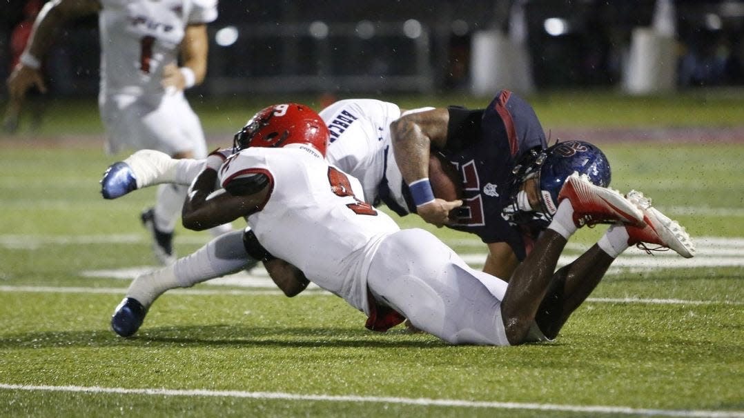 Southeastern defensive back Khalid Scott makes a tackle in a contest vs. St. Thomas on Sept. 24, 2022 in Miami Gardens. Southeastern would go on to lose 34-14.