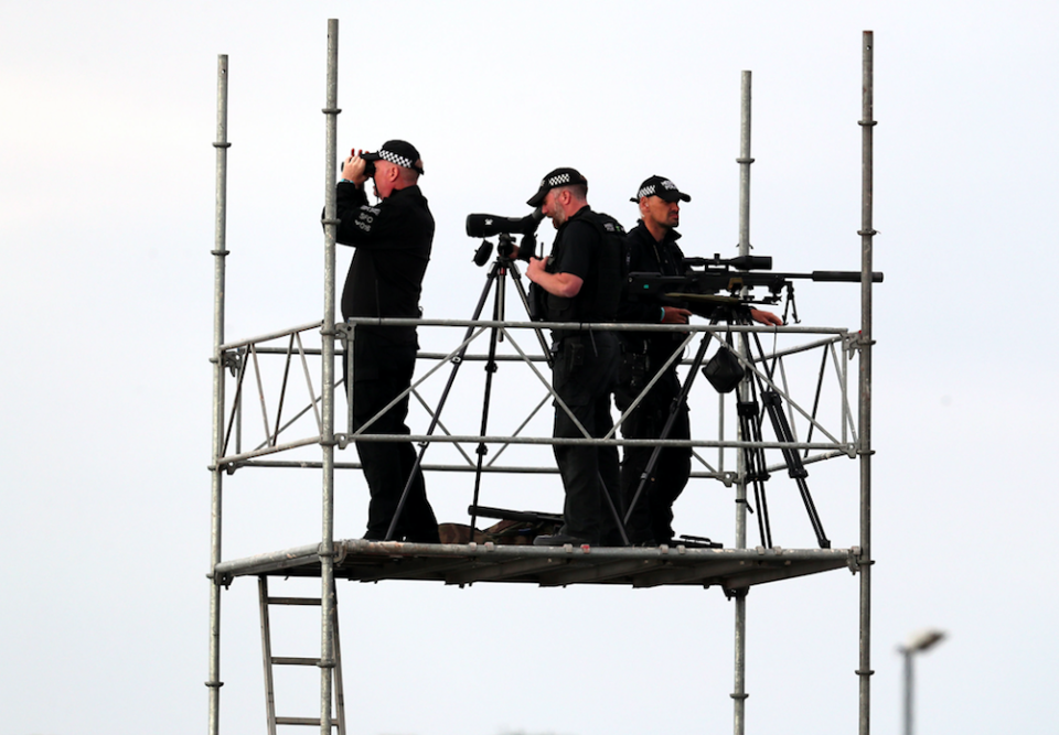 <em>Police on guard point at Prestwick airport in Ayrshire, before President Donald Trump’s arrival (PA)</em>