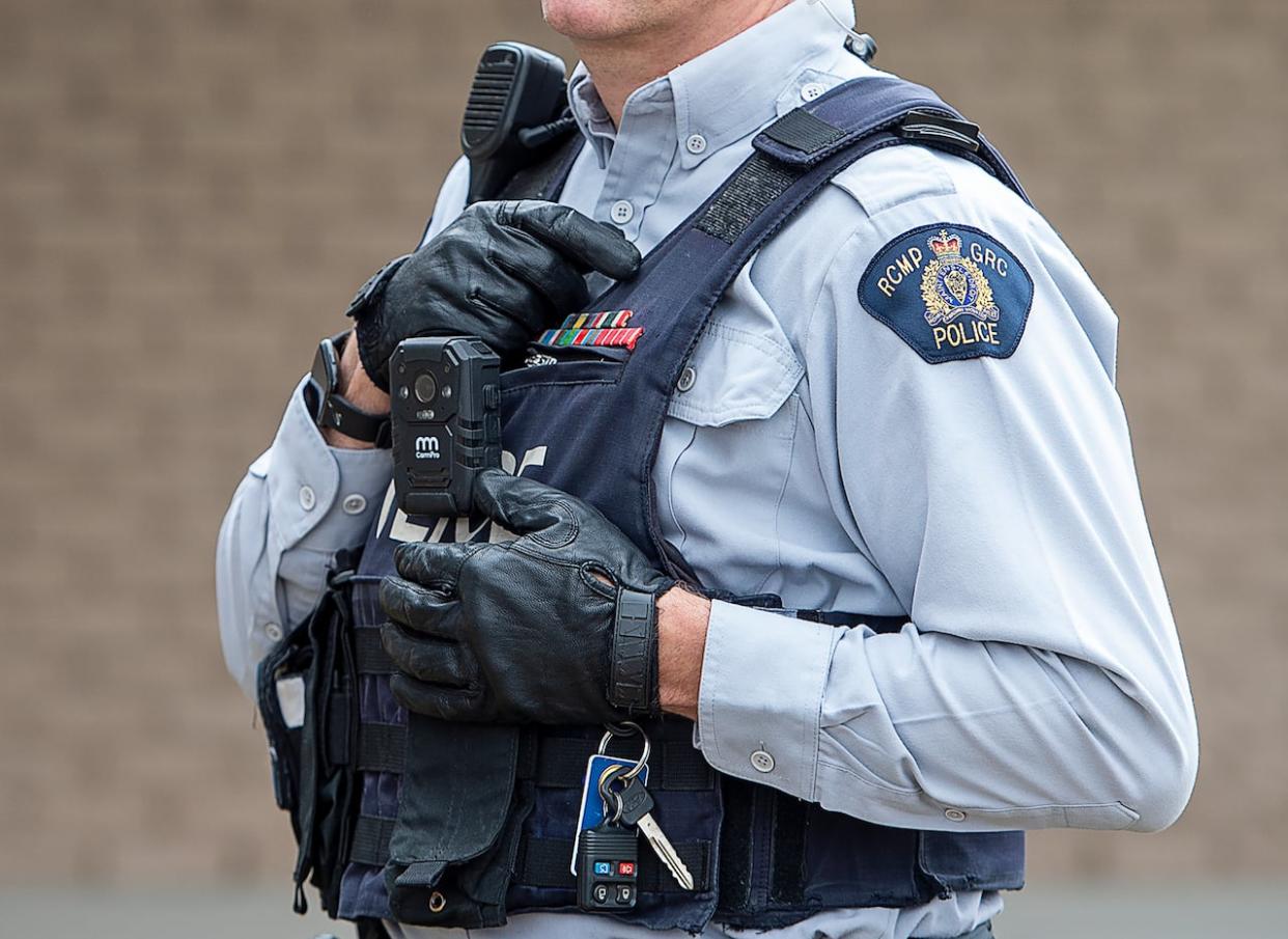 An RCMP officer wears a body camera at the detachment in Bible Hill, N.S. on Sunday, April 18, 2021. (Andrew Vaughan/Canadian Press - image credit)