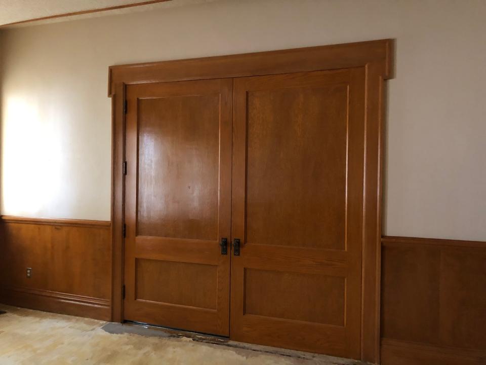 M.F. and Oscar Hawkins built the paneling, stairs, cabinets and inlaid wood floors throughout the house. The cabinet in the Bivins Home still holds old library index cards from the past.