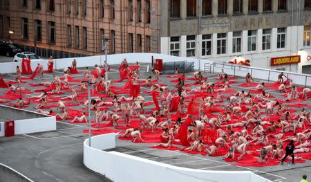 REFILE - CORRECTING OBJECT NAME Contemporary New York artist Spencer Tunick is seen photographing nude Melburnians for his latest piece "Return of the Nude", as part of Chapel St, Prahran's Provocare festival, in Melbourne, Australia, July 9, 2018. AAP/Penny Stephens/via REUTERS