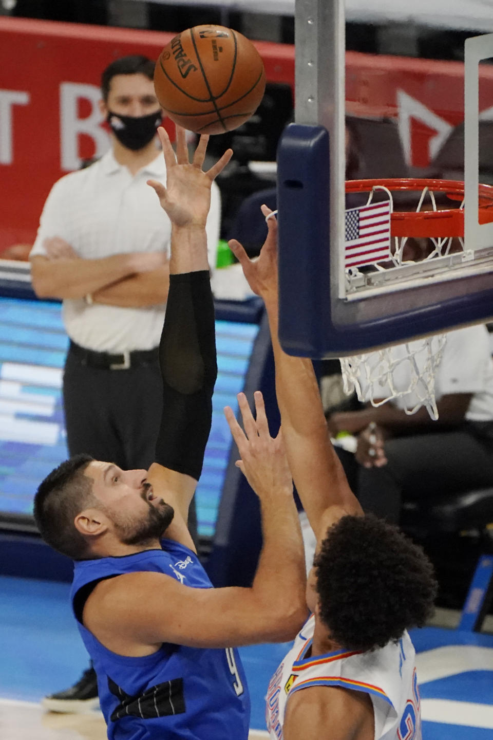 Orlando Magic center Nikola Vucevic (9) shoots over Oklahoma City Thunder forward Isaiah Roby, right, in the first half of an NBA basketball game Tuesday, Dec. 29, 2020, in Oklahoma City. (AP Photo/Sue Ogrocki)