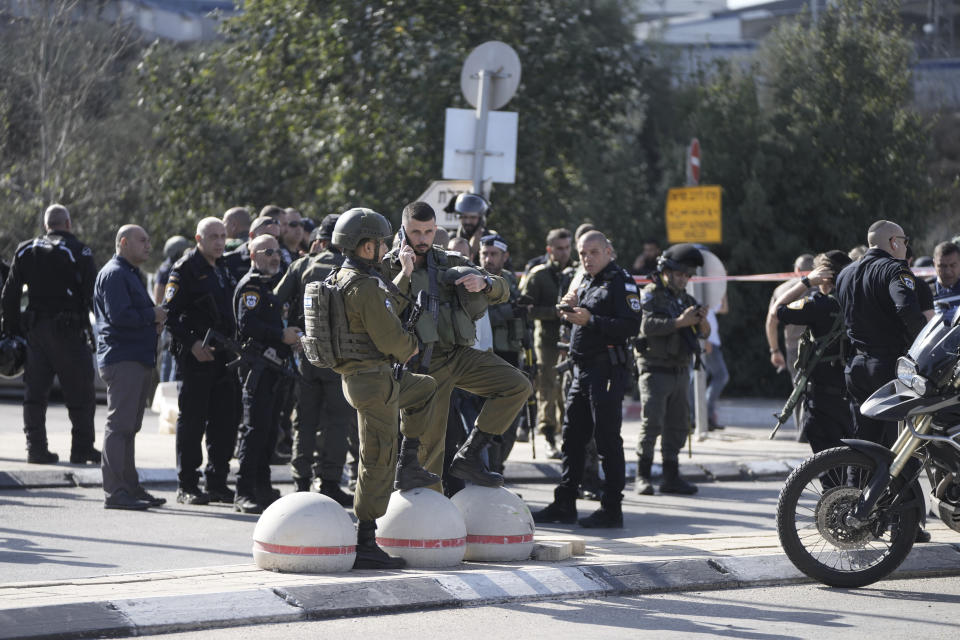 Israeli police stand at a checkpoint leading to the West Bank in Jerusalem Thursday, Nov. 16, 2023. Six people were wounded in a shooting attack by three Palestinians at the checkpoint who were all shot dead on the scene, according to Magen David Adom Emergency Services. (AP Photo/Mahmoud Illean)