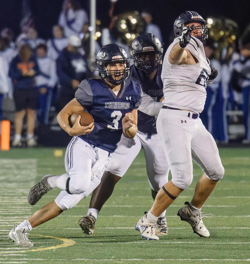 Twinsburg quarterback Joey Pollock looks for running room Thursday at home against Hudson