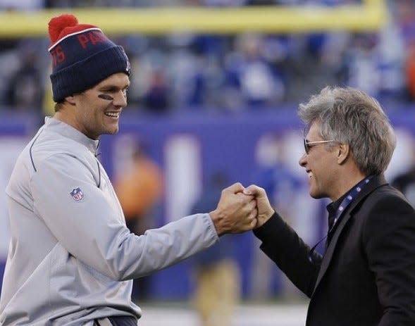 Tom Brady (left) with Jon Bon Jovi. The singer was a regular in the luxury box of New England Patriots owner Robert Kraft during the team's home games.