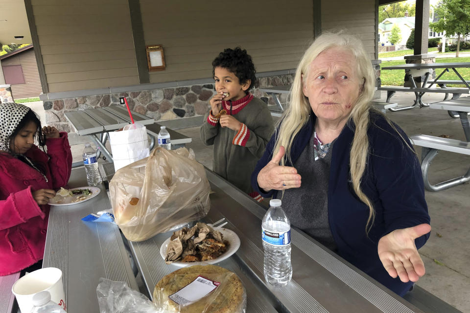 Sherry Darwin of Oshkosh, Wis., talks about her support for President Donald Trump while picnicking with her grandson Donald in a park Tuesday, Sept. 29, 2020. "I don't even believe it's true," the 75-year-old retiree says of reports Trump paid little in income taxes in the years before becoming president.(AP Photo/Thomas Beaumont)