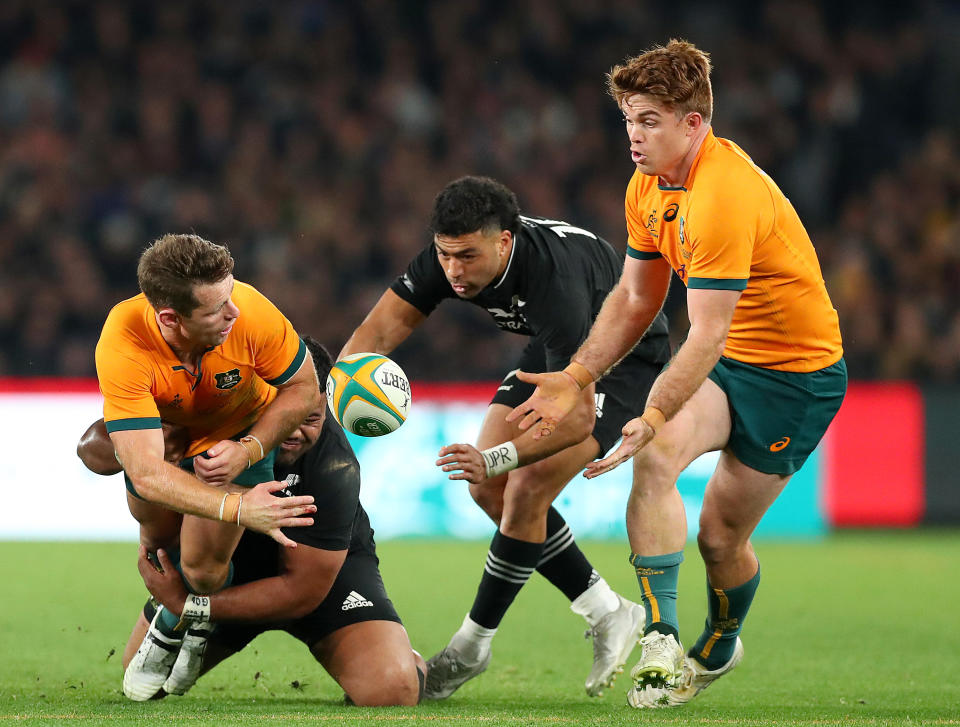 Seen here, Bernard Foley passes to Wallabies teammate Andrew Kellaway during the Bledisloe Cup Test against New Zealand at Melbourne's Marvel Stadium. 