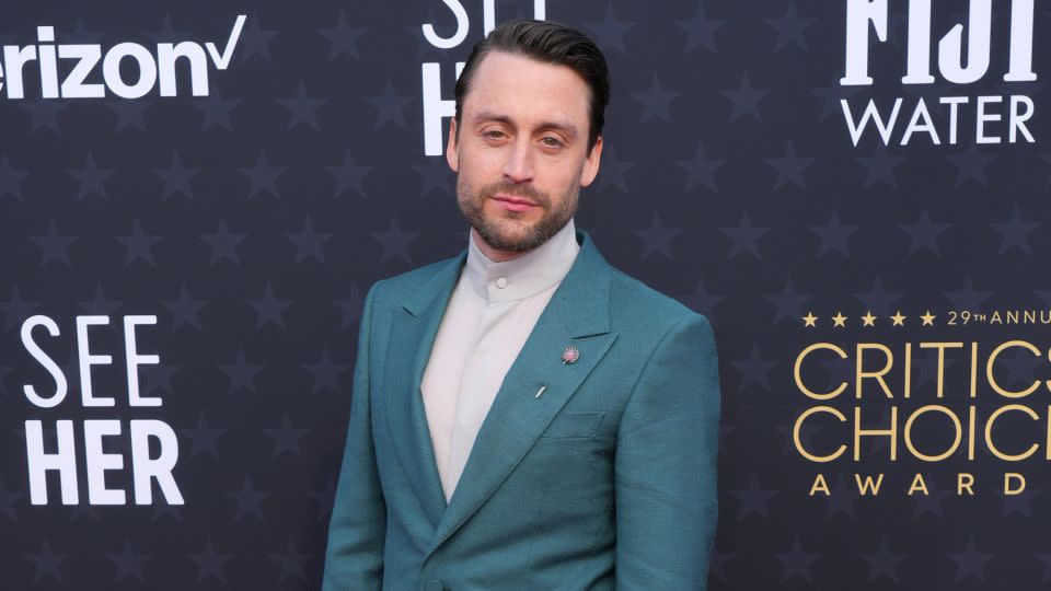 Kieran Culkin, who went on to win Best Actor in a Drama Series, sported a teal Zegna suit paired with beaded turquoise bracelets and an antique shell motif stick pin from jeweler Martin Katz. - Jordan Strauss/Invision/AP