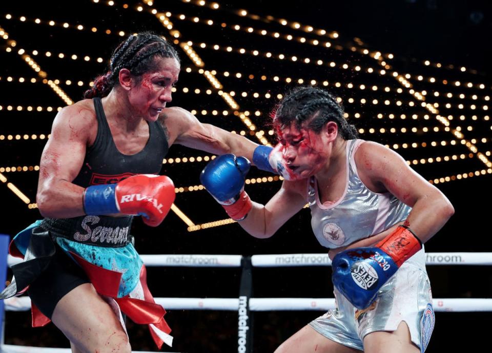 Amanda Serrano punches Erika Cruz during their title fight at the Theater at Madison Square Garden, New York (Getty)