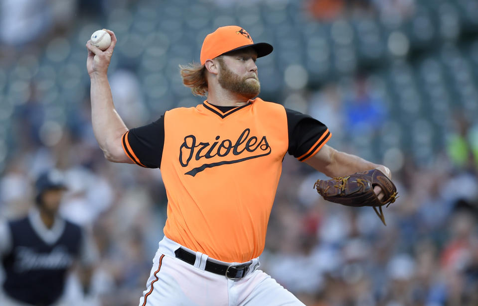 Baltimore Orioles starting pitcher Andrew Cashner delivers a pitch during the first inning of the second baseball game of a split doubleheader against the New York Yankees, Saturday, Aug. 25, 2018, in Baltimore. (AP Photo/Nick Wass)