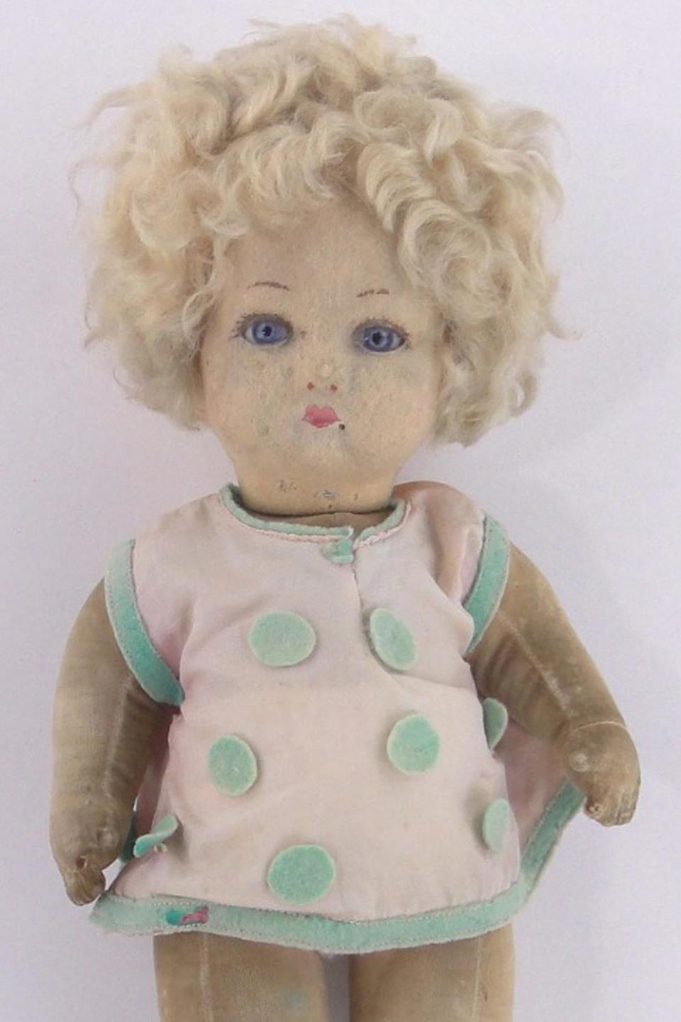 Doll: The felt doll circa 1930 originally belonged to Princess Elizabeth and Princess Margaret (www.burstowandhewett.co.uk)