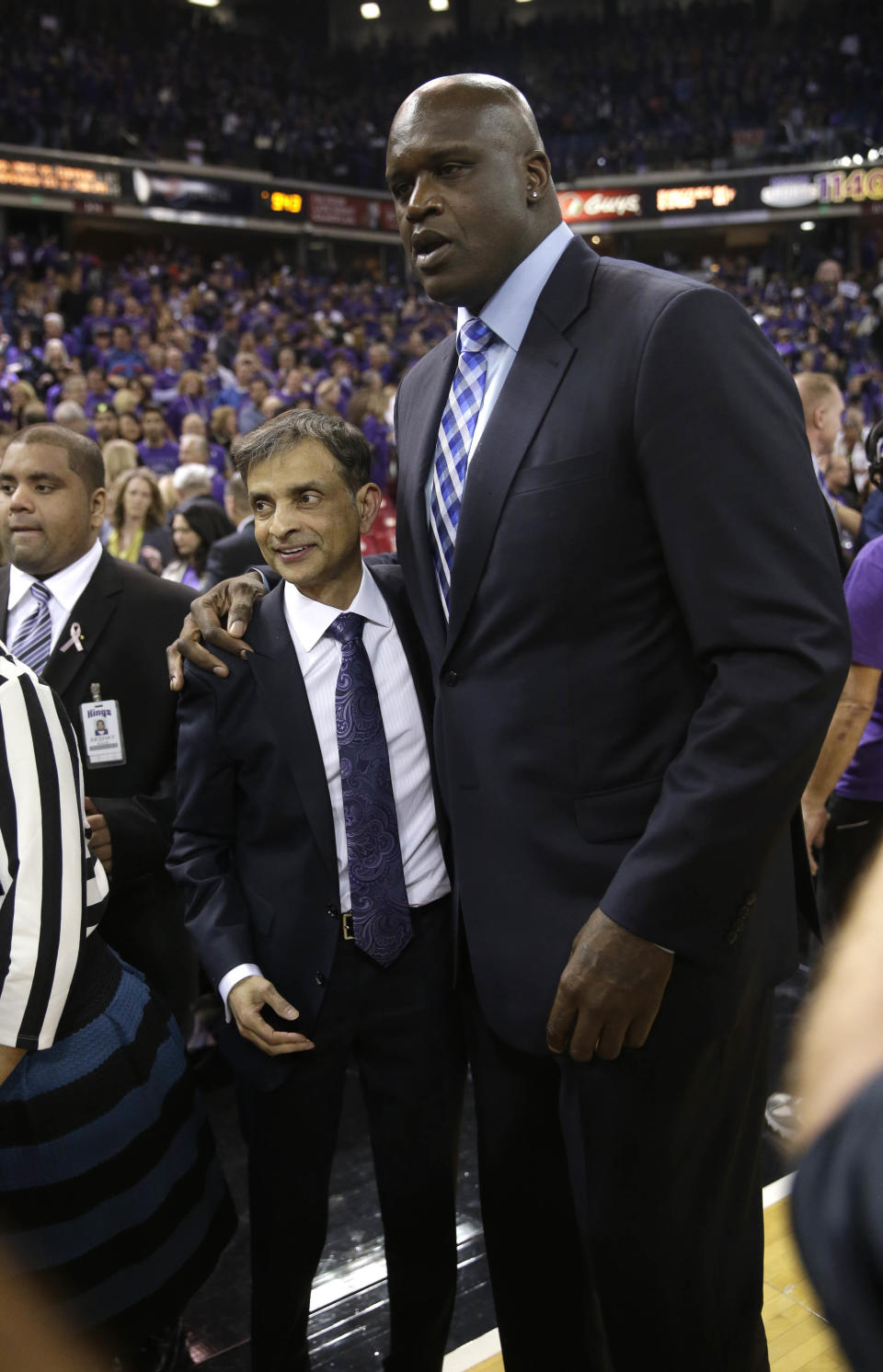 FILE -- In tis Oct. 30, 2013 file photo, Sacramento Kings majority owner Vivek Ranadive, left, and former NBA center Shaquille O'Neal, a minority owner of the Kings, celebrate after the team defeated the Denver Nuggets 90-88 in an NBA preseason basketball game in Sacramento, Calif. Ranadive, a successful Silicon Valley software pioneer, emerged at the intersection of politics and sports last year as he led a consortium of owners to purchase the Sacramento Kings, becoming the leagues first Indian-American owner.(AP Photo/Rich Pedroncelli, file)