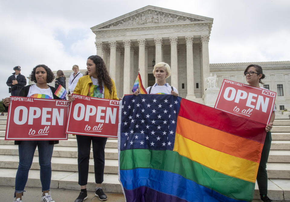 American Civil Liberties Union activists demonstrate in front of the Supreme Court, Monday, June 4, 2018 in Washington. The Supreme Court has ruled for a Colorado baker who wouldn’t make a wedding cake for a same-sex couple in a limited decision that leaves for another day the larger issue of whether a business can invoke religious objections to refuse service to gay and lesbian people. (AP Photo/J. Scott Applewhite)