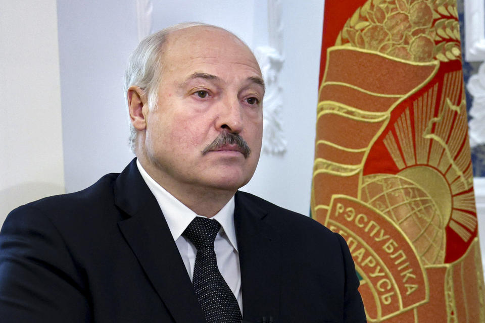 Belarusian President Aleksandr Lukashenko speaks during his interview with the Russian magazine of the Natsionalnaya Oborona (National Defense) in Minsk, Belarus, Tuesday, Nov. 9, 2021. Lukashenko blasted Poland's heavy-handed response to migrants gathering at the border. (Nikolai Petrov/BelTA Pool Photo via AP)