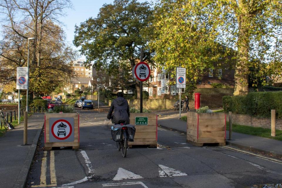 A low traffic neighbourhood trial in London, which uses planters to help stop motor traffic <i>(Image: Jack Fifield, Newsquest)</i>