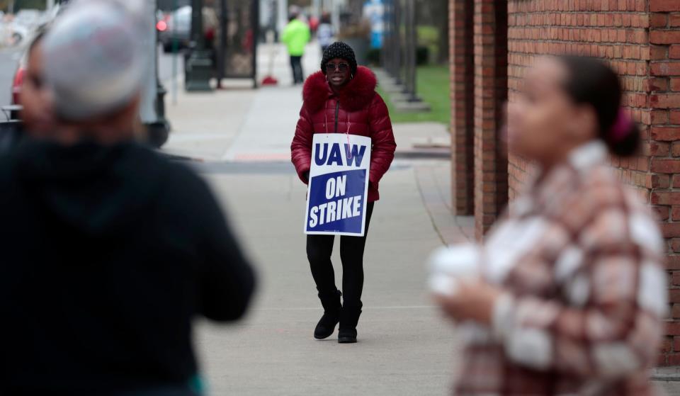 Jecinda Jones-Betttie, 49, of Warren, who works in the financial department at Blue Cross and Blue Shield, walks the picket line in downtown Detroit on Thursday, Oct. 19, 2023.