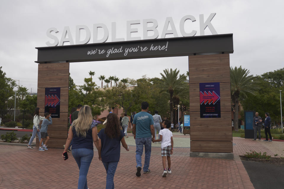 FILE - Congregants arrive at Saddleback Church in Lake Forest, Calif., on Sunday, Oct. 16, 2022. Retired pastor Rick Warren, who is expected to speak on behalf of Saddleback on Tuesday, June 13, 2023, at the opening of the Southern Baptist Convention’s annual meeting, has been intensifying a media blitz in what he acknowledges may be a lost cause. He is trying to get the Southern Baptist Convention to reverse its ouster of the California megachurch he founded, Saddleback Church, for having women pastors. (AP Photo/Allison Dinner, File)