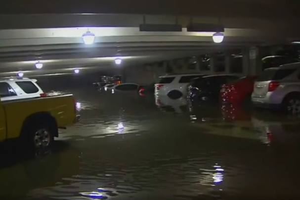 US weather: Dozens of cars under water at Dallas airport after flash flooding