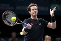 Andy Murray of Britain returns the ball to David Ferrer of Spain in their men's singles semi-final tennis match at the Paris Masters tennis tournament at the Bercy sports hall in Paris, France, November 7, 2015. REUTERS/Charles Platiau