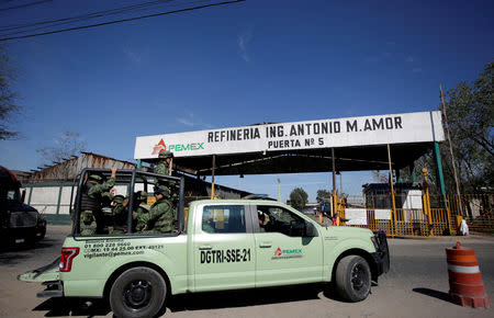 Soldiers patrol the perimeter of the state oil firm Petroleos Mexicanos (Pemex) refinery in Salamanca, in Guanajuato state, Mexico January 8, 2019. REUTERS/Daniel Becerril