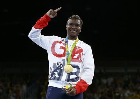 2016 Rio Olympics - Boxing - Victory Ceremony - Women's Fly (51kg) Victory Ceremony - Riocentro - Pavilion 6 - Rio de Janeiro, Brazil - 20/08/2016. Gold medallist Nicola Adams (GBR) of Britain poses with her medal. REUTERS/Peter Cziborra