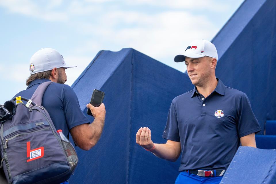 September 25, 2023; Rome, ITALY; Team USA golfer Max Homa (left) and golfer Justin Thomas (right) gesture on the driving range prior to the start of the Ryder Cup golf competition at Marco Simone Golf and Country Club. Mandatory Credit: Kyle Terada-USA TODAY Sports