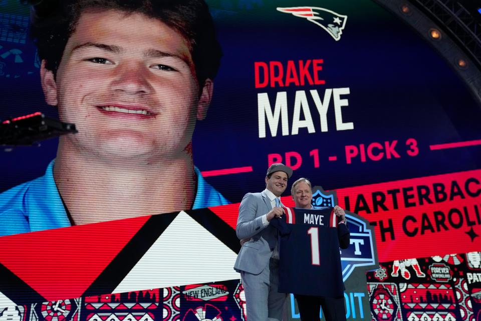 North Carolina quarterback Drake Maye poses with NFL commissioner Roger Goodell after being chosen by the New England Patriots with the third overall pick during the first round of the NFL football draft, Thursday, April 25, 2024, in Detroit. (AP Photo/Jeff Roberson)