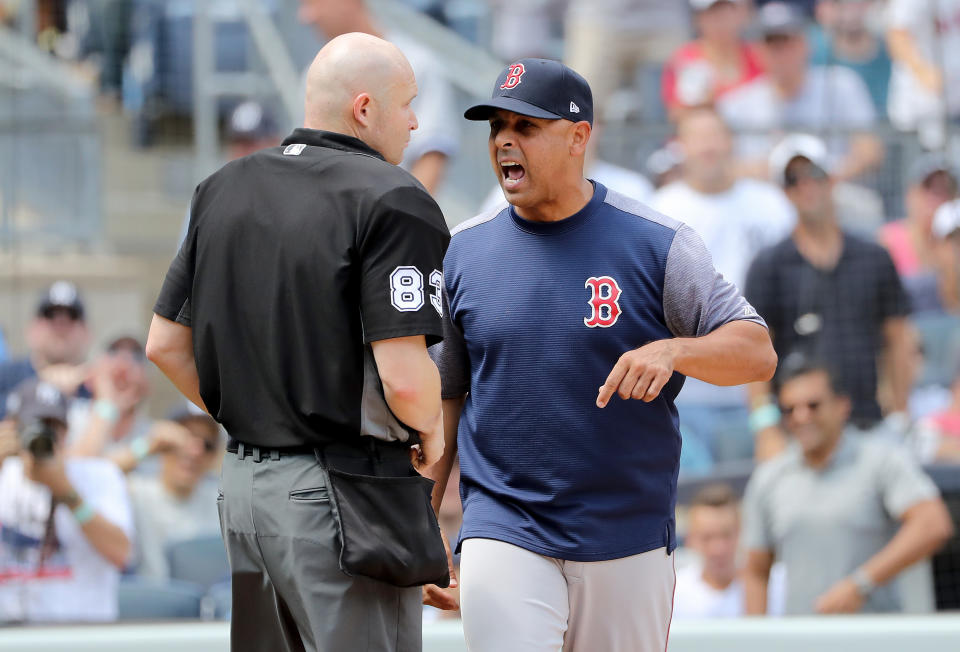 NEW YORK, NEW YORK - AUGUST 03:  Manager Alex Cora #20 of the Boston Red Sox argues with home plate umpire Mike Estabrook after Cora was tossed from the game in the fourth inning against the New York Yankees during game one of a double header at Yankee Stadium on August 03, 2019 in the Bronx borough of New York City. (Photo by Elsa/Getty Images)