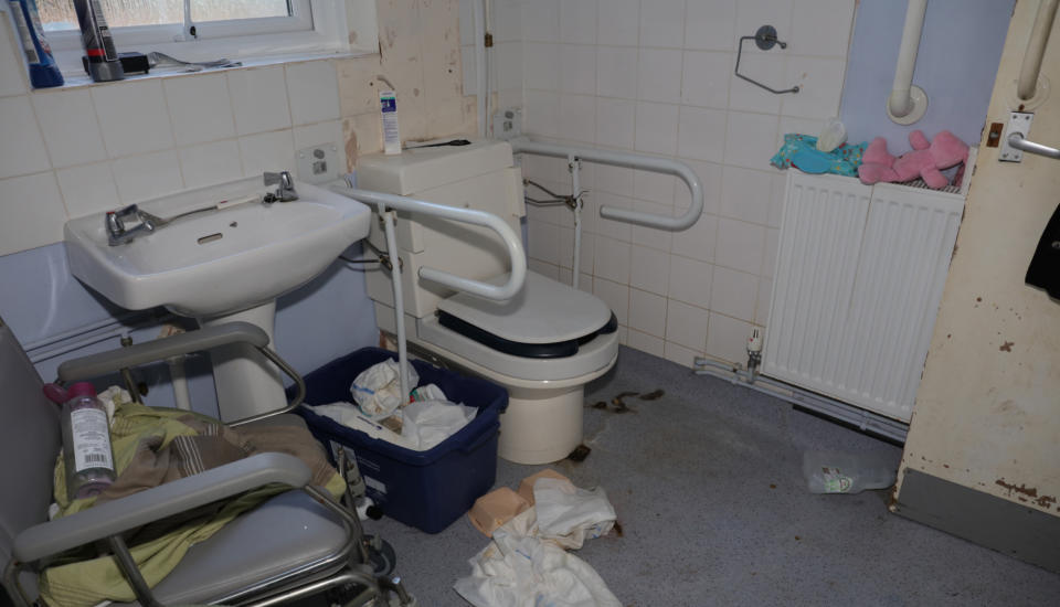 The bathroom used by Kaylea Titford was found with dirty and used towels and pads on the floor. (PA)