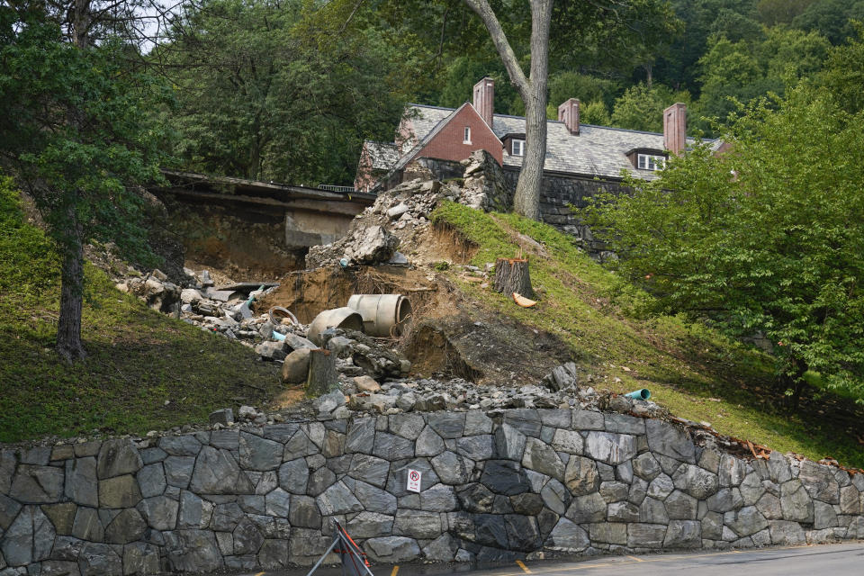 A collapsed road on the campus of the United States Military Academy at West Point is seen in Highland Falls, N.Y., Monday, July 17, 2023. Heavy rains are pounding an already saturated Northeast for the second time in a week, spurring another round of flash flooding, canceled airline flights and power outages. (AP Photo/Seth Wenig)