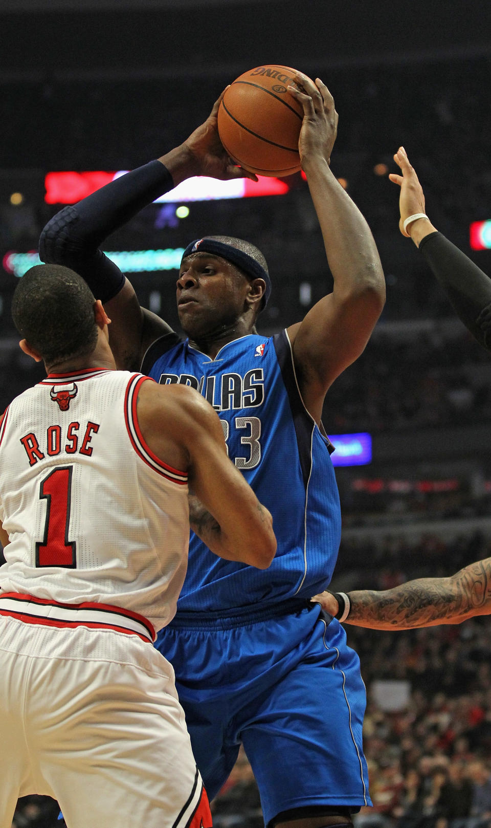 CHICAGO, IL - APRIL 21: Brendan Haywood #33 of the Dallas Mavericks looks to pass under pressure from Derrick Rose #1 of the Chicago Bulls at the United Center on April 21, 2012 in Chicago, Illinois. NOTE TO USER: User expressly acknowledges and agress that, by downloading and/or using this photograph, User is consenting to the terms and conditions of the Getty Images License Agreement. (Photo by Jonathan Daniel/Getty Images)