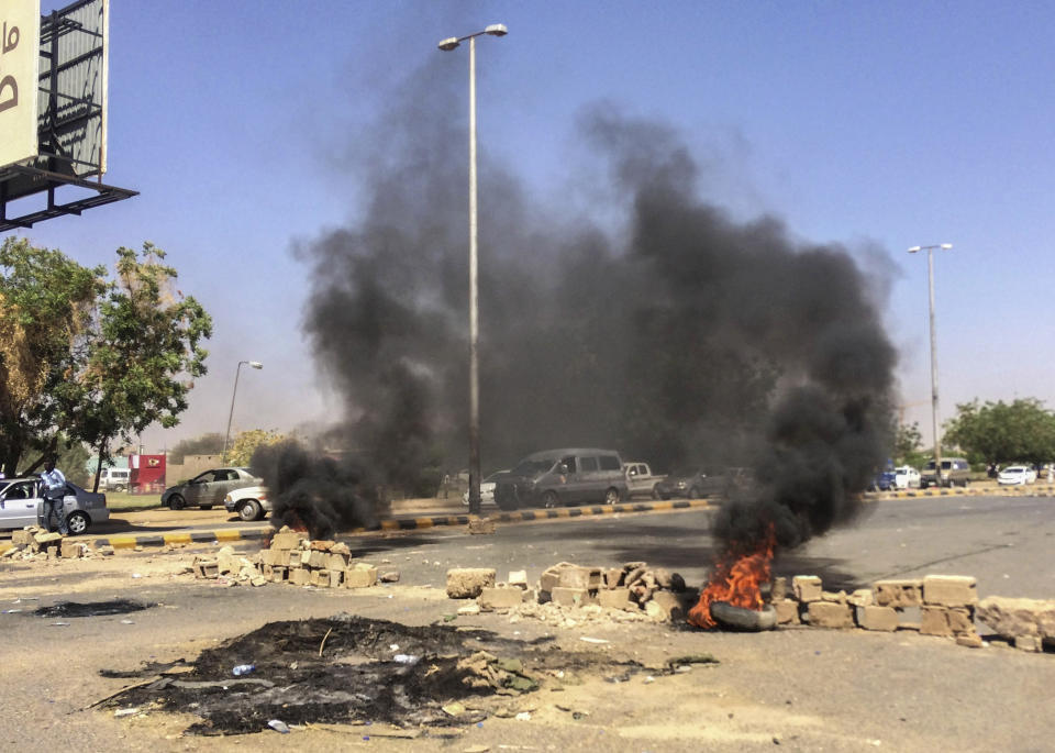 Tires lit by protesters burn near the military headquarters, Sunday, April 7, 2019, in the capital Khartoum, Sudan. Organizers behind anti-government demonstrations in Sudan said Sunday that security forces have killed at least five protesters in the last twenty-four hours. The current wave of unrest erupted in December, initially over price hikes and shortages of food and fuel, but the demonstrations quickly morphed into calls for the overthrow of President Omar al-Bashir. (AP Photo)