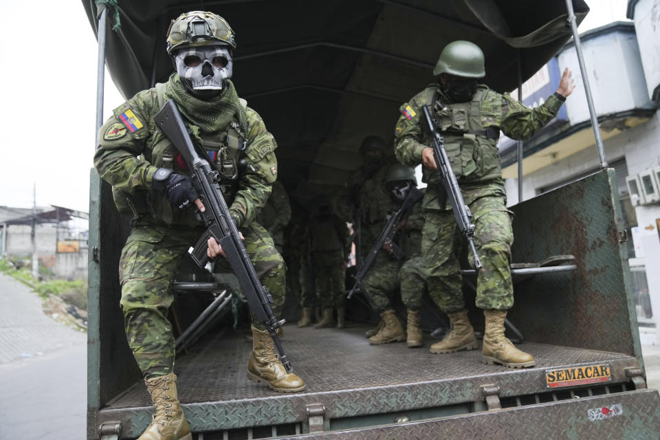 Soldiers patrol a residential area on the south side of Quito, Ecuador, Friday, Jan. 12, 2024, in the wake of the apparent escape of a powerful gang leader from prison. President Daniel Noboa decreed Monday a national state of emergency, a measure that lets authorities suspend people’s rights and mobilize the military in places like the prisons. The government also imposed a curfew from 11 p.m. to 5 a.m. (AP Photo/Dolores Ochoa)