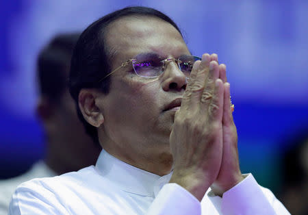 Sri Lanka's President Maithripala Sirisena prays during a special party convention in Colombo, Sri Lanka December 4, 2018. REUTERS/Dinuka Liyanawatte