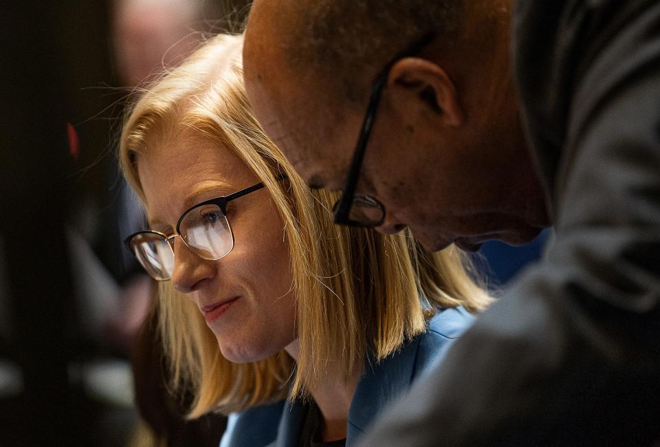 Kentucky Sen. Cassie Chambers Armstrong, left, confers with Sen. Reginald Thomas during Senate proceedings on March 16, 2023.