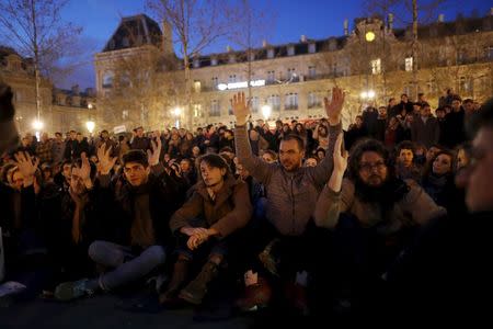 Supporters of social media-driven movement "Nuit Debout" (Up All Night), gather on the Place de la Republique in Paris, France, against a French labour law proposal, April 11, 2016. REUTERS/Benoit Tessier