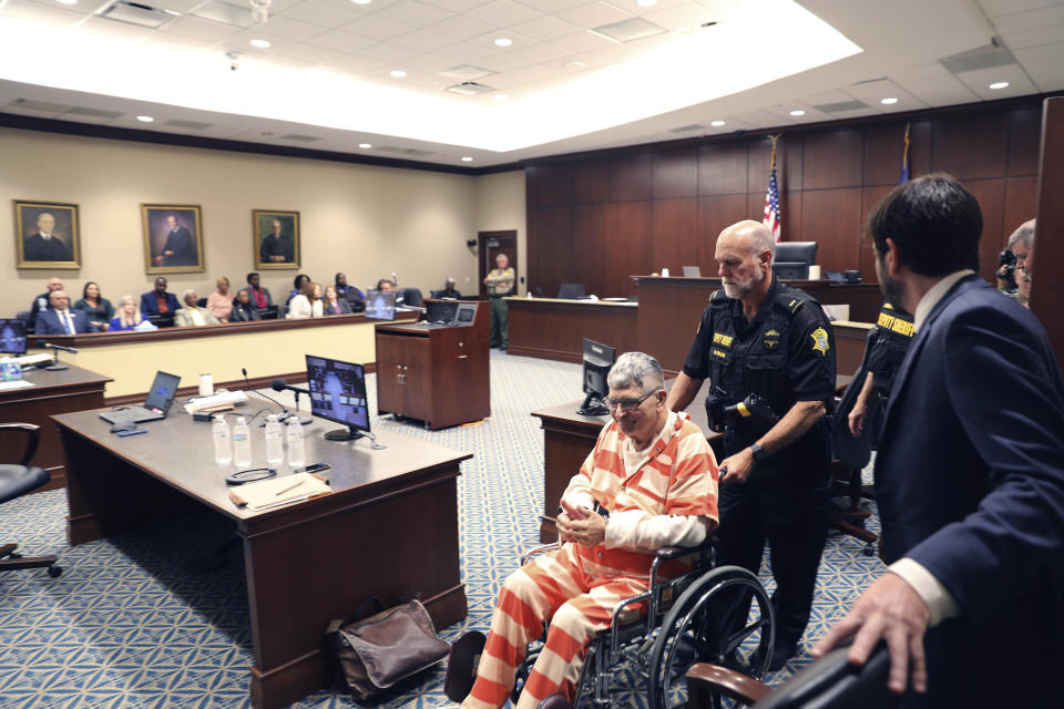 Frederick Hopkins is wheeled into the courtroom before his sentencing hearing in Florence, S.C., on Thursday, Oct. 19, 2023. Hopkins was sentenced to life in prison without parole for killing two police officers and wounding five others in an October 2018 ambush at his Florence home (AP Photo/Jeffrey Collins).