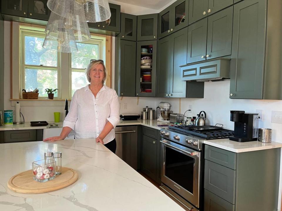 Barb Swantner is shown in the kitchen of her 1870s home on Abend Street in Belleville. She’s renovating it and converting it from three apartments back into a single-family residence.