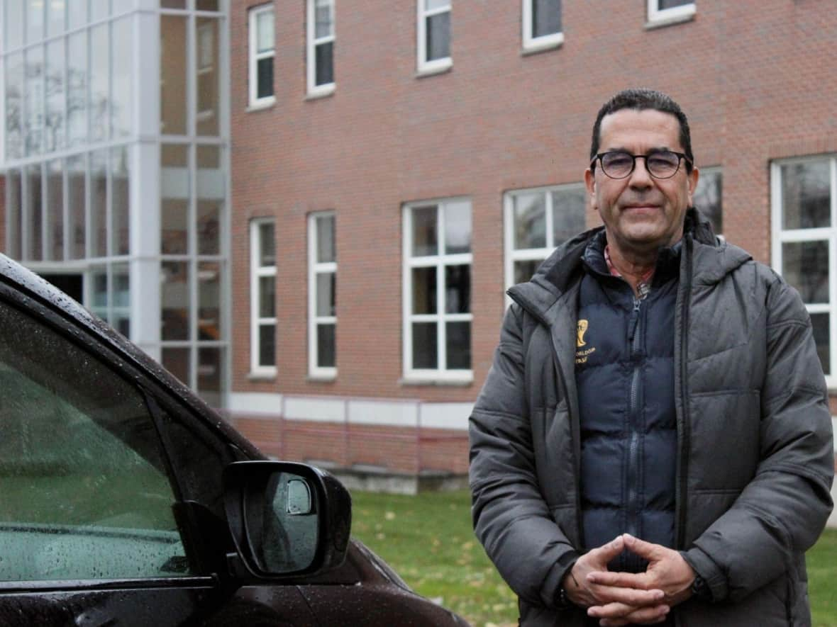 Adrian Mendez in front of Holland College's Charlottetown campus.   (Thinh Nguyen/CBC - image credit)